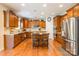 Well-appointed kitchen with granite countertops, stainless steel appliances, and a convenient center island with seating at 2610 Mchanna Pt, Fort Mill, SC 29708