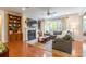 Inviting living room with fireplace, built-in bookshelves, hardwood floors, and a comfortable gray sofa at 2610 Mchanna Pt, Fort Mill, SC 29708