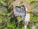 Aerial view of home featuring a new roof, mature trees, and lush landscaping at 2731 Laugenour Pl, Kannapolis, NC 28081