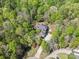 Aerial view of home nestled among mature trees and lush landscaping at 2731 Laugenour Pl, Kannapolis, NC 28081