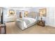 Large bedroom with a light gray bed, white dresser, neutral walls, and bedside table at 2731 Laugenour Pl, Kannapolis, NC 28081