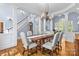 Elegant dining room featuring hardwood floors, a chandelier, and ample seating for entertaining guests at 2731 Laugenour Pl, Kannapolis, NC 28081