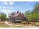 Beautiful exterior view of brick home with manicured lawn and professional landscaping at 2731 Laugenour Pl, Kannapolis, NC 28081