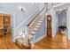 Elegant foyer with staircase, hardwood floors, and tasteful decor creating a welcoming entrance at 2731 Laugenour Pl, Kannapolis, NC 28081
