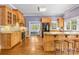 Charming kitchen featuring custom wood cabinets, granite countertops, and stainless steel appliances at 2731 Laugenour Pl, Kannapolis, NC 28081