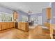 Spacious kitchen with wood cabinets, granite countertops, and an adjacent dining area at 2731 Laugenour Pl, Kannapolis, NC 28081