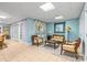 Living area with blue walls, tile floors, seating, and French doors to another room at 2731 Laugenour Pl, Kannapolis, NC 28081