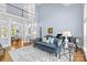 Bright living room boasting high ceilings, hardwood floors, a balcony, and an elegant piano at 2731 Laugenour Pl, Kannapolis, NC 28081