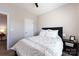 Cozy bedroom with a queen bed, soft lighting, and neutral decor at 325 Crandon Rd, Mount Holly, NC 28120