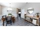 Open dining room with a wooden table, stylish chairs, and decor, leading into a cozy living area at 325 Crandon Rd, Mount Holly, NC 28120