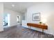 Upstairs hallway featuring plush carpeting, a small wooden table, and neutral walls at 325 Crandon Rd, Mount Holly, NC 28120