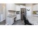 Galley kitchen with white cabinets, granite counters, and stainless appliances; breakfast bar at 325 Crandon Rd, Mount Holly, NC 28120