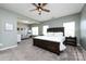 Spacious main bedroom showcasing large bed and sitting area with neutral tones at 325 Crandon Rd, Mount Holly, NC 28120