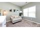 Relaxing sitting area with plush chair, soft lighting, and a decorative mirror at 325 Crandon Rd, Mount Holly, NC 28120