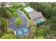 Overhead shot of the community pool, tennis court, clubhouse, and parking lot at 331 Miners Cove Way, Fort Mill, SC 29708