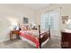 This bedroom is filled with natural light, complementing the beautiful bed and classic bedside tables at 331 Miners Cove Way, Fort Mill, SC 29708