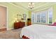 Bright bedroom featuring a bay window, tray ceiling, and elegant furnishings at 331 Miners Cove Way, Fort Mill, SC 29708