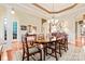 Formal dining area featuring hardwood floors, elegant lighting, and a decorative rug at 331 Miners Cove Way, Fort Mill, SC 29708