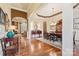 Open-concept dining area showcasing hardwood floors, elegant furnishings, and natural light at 331 Miners Cove Way, Fort Mill, SC 29708