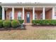 Charming front porch with brick facade, trimmed shrubs and a welcoming entrance at 331 Miners Cove Way, Fort Mill, SC 29708
