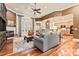 Spacious living room featuring hardwood floors, a fireplace, and abundant natural light at 331 Miners Cove Way, Fort Mill, SC 29708