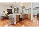 Cozy open floor plan featuring hardwood floors, a fireplace, and seamless flow into the kitchen at 331 Miners Cove Way, Fort Mill, SC 29708