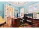 This bright office features a large desk and a comfortable chair along with lovely decor at 331 Miners Cove Way, Fort Mill, SC 29708