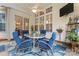 Covered patio with comfortable seating, ceiling fan, and a view of the outdoors at 331 Miners Cove Way, Fort Mill, SC 29708