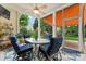 Relaxing screened patio featuring cozy seating and views of the lush backyard at 331 Miners Cove Way, Fort Mill, SC 29708