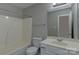 The bathroom features a combination shower and tub, toilet, and vanity with sink and mirror at 3835 Mohawk Ct, Charlotte, NC 28215