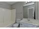 The bathroom features a combination shower and tub, toilet, and vanity with sink and mirror at 3835 Mohawk Ct, Charlotte, NC 28215