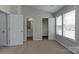 Bedroom with neutral walls, carpeted floor, and access to ensuite bathroom and closet at 3835 Mohawk Ct, Charlotte, NC 28215