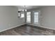 Cozy dining area with wood-look flooring and plenty of natural light at 3835 Mohawk Ct, Charlotte, NC 28215