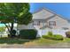Charming home exterior with manicured lawn, mature tree, and a white picket fence at 3835 Mohawk Ct, Charlotte, NC 28215