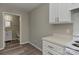 Kitchen area featuring a convenient pass-through view into an adjacent bathroom with a modern sink at 3835 Mohawk Ct, Charlotte, NC 28215
