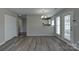 Open living area with wood-look floors adjacent to the kitchen at 3835 Mohawk Ct, Charlotte, NC 28215
