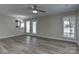 Bright and spacious living room with wood-look flooring and easy access to the outside at 3835 Mohawk Ct, Charlotte, NC 28215
