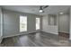 Spacious living room featuring wood-look flooring and plenty of natural light at 3835 Mohawk Ct, Charlotte, NC 28215