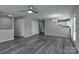 Open-concept living area with wood-look flooring connecting seamlessly to the kitchen at 3835 Mohawk Ct, Charlotte, NC 28215