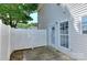 Enclosed back patio area with white picket fence and a glass door to the house at 3835 Mohawk Ct, Charlotte, NC 28215