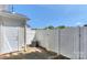 Enclosed back patio area with white picket fence and access to a small storage area at 3835 Mohawk Ct, Charlotte, NC 28215