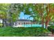 Community pool area with lounge chairs and umbrellas at 3835 Mohawk Ct, Charlotte, NC 28215