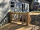 Back deck with a wooden railing at 3925 Taylorsville Hwy, Statesville, NC 28625
