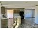 Open kitchen with an island, sleek appliances, and hardwood floors at 3925 Taylorsville Hwy, Statesville, NC 28625