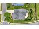 An aerial view of a well-maintained home featuring a gray roof, lush landscaping, and a concrete driveway at 4006 Fall Oak Ter, Fort Mill, SC 29707