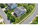 Aerial view of a home showcasing a gray roof, well-manicured lawn, and landscaped garden at 4006 Fall Oak Ter, Fort Mill, SC 29707