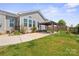 Spacious backyard featuring a covered gazebo, lush green grass, and a well-maintained lawn at 4006 Fall Oak Ter, Fort Mill, SC 29707