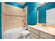 Bathroom featuring tile tub, toilet, marble vanity, tile floors and bright blue walls at 4006 Fall Oak Ter, Fort Mill, SC 29707