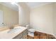 Charming half bath with patterned wallpaper and granite counters at 4006 Fall Oak Ter, Fort Mill, SC 29707