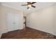 Bedroom with hardwood floors, ceiling fan, closet and doorway that could lead to an ensuite at 4006 Fall Oak Ter, Fort Mill, SC 29707